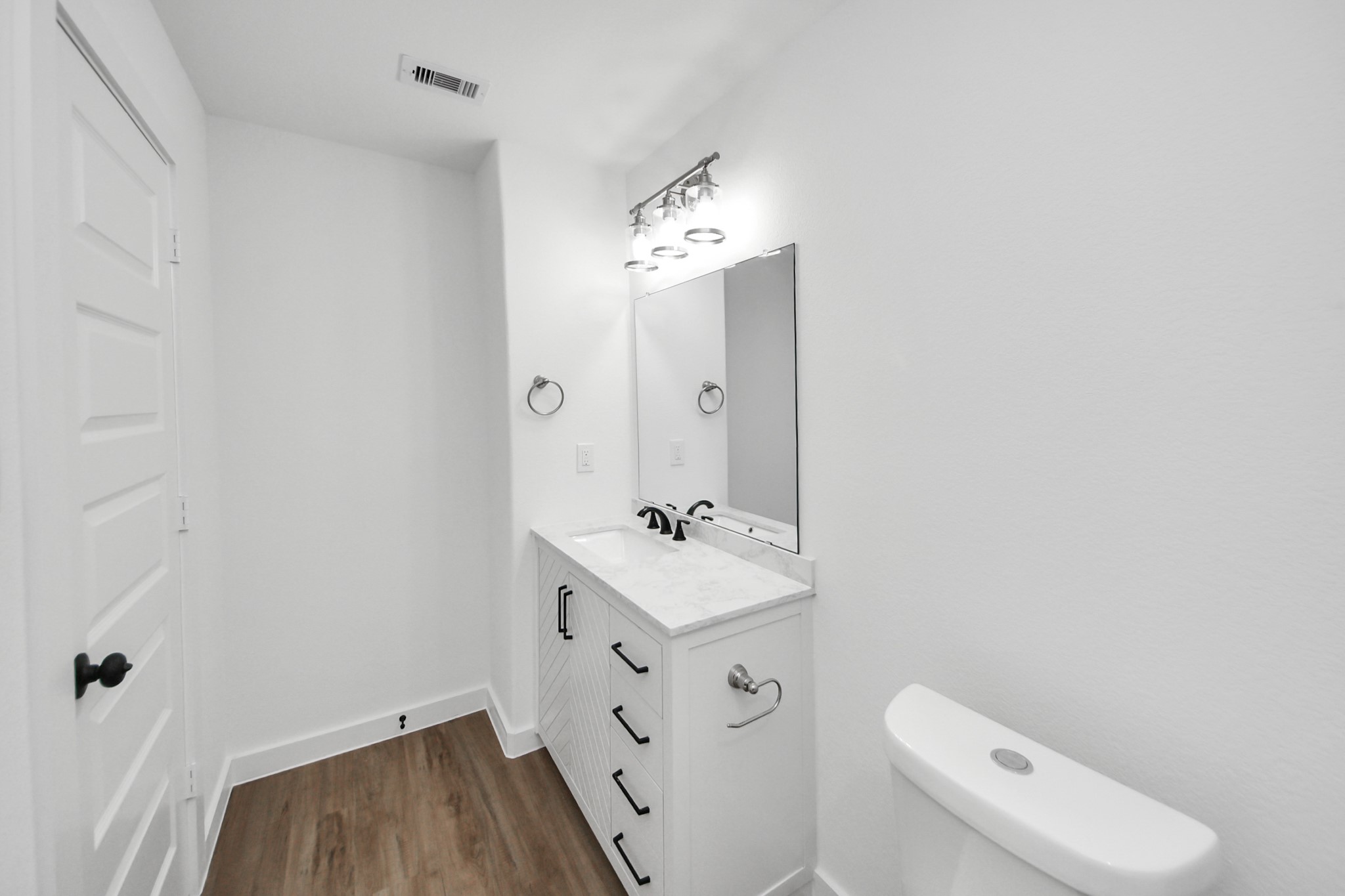 7312 Wileyvale Road, Unit C Houston, TX 77016 - Photo 32 of 39 a bathroom with a sink a toilet a mirror and shower