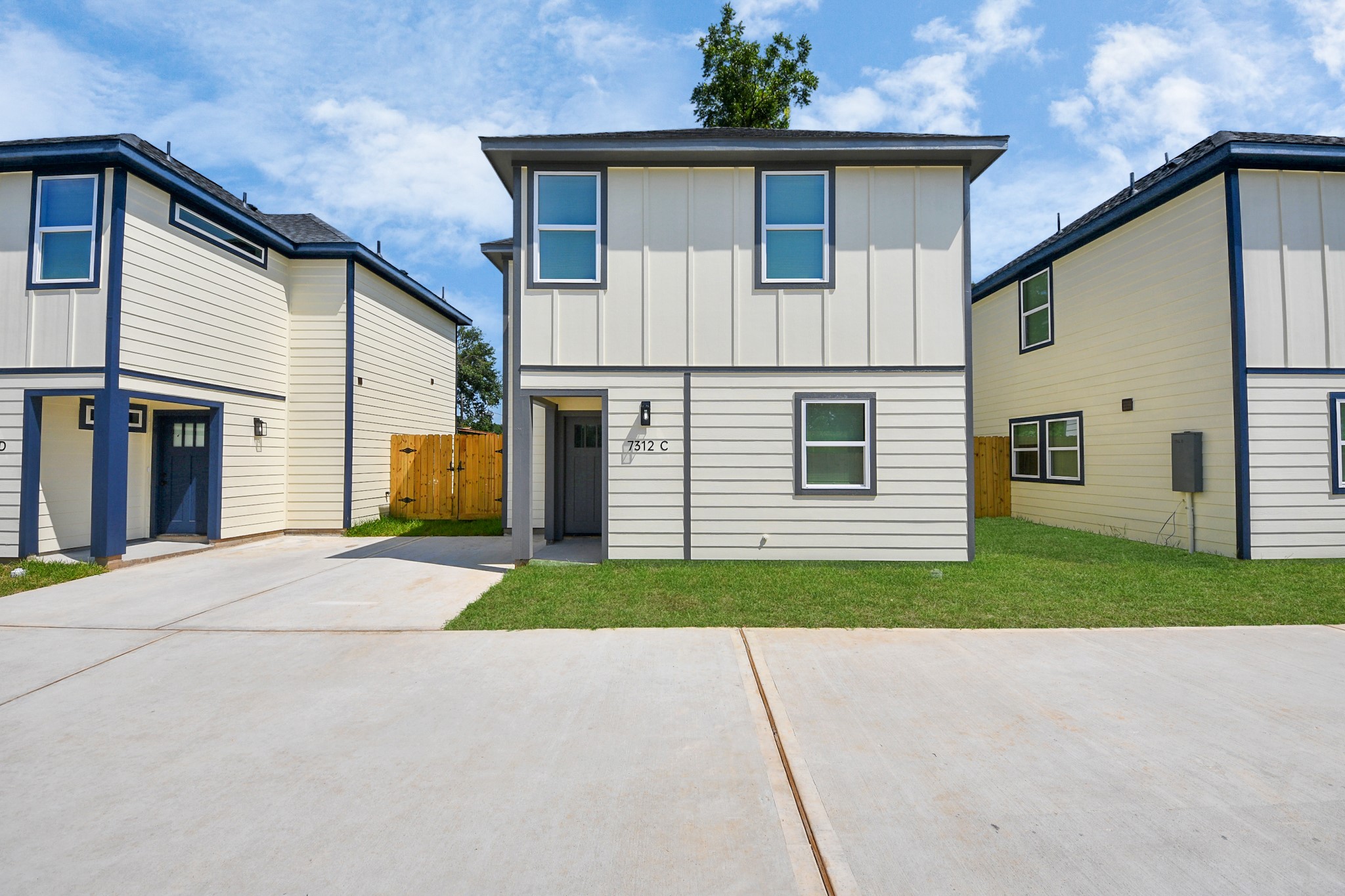 7312 Wileyvale Road, Unit C Houston, TX 77016 - Photo 8 of 39 a front view of a house with a yard and garage