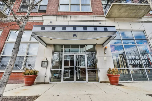 a front view of a building with outdoor seating