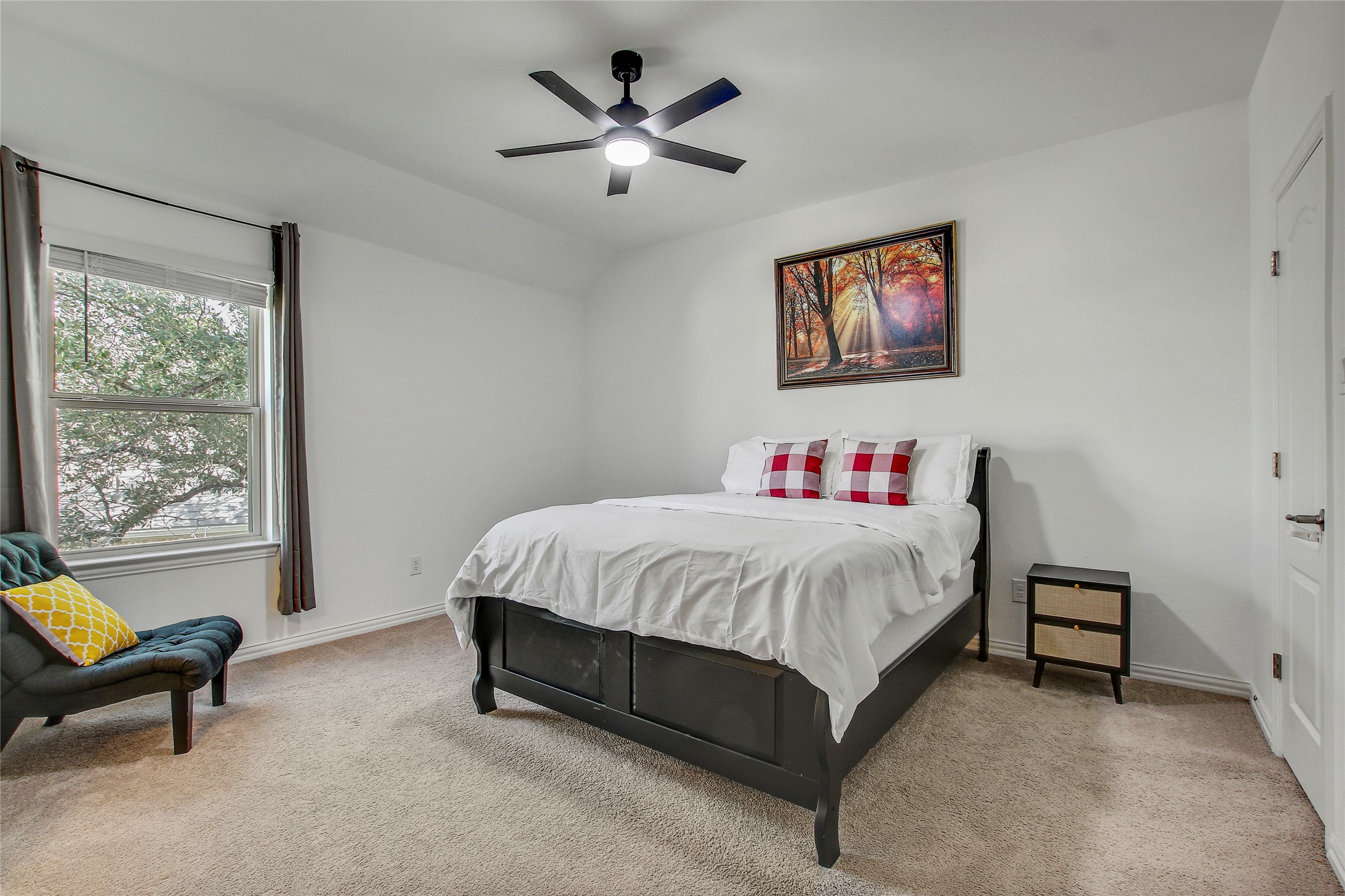 104 Millbend Road Georgetown, TX 78633 - Photo 28 of 40 A tranquil bedroom retreat features a window with natural light, perfect for relaxation.