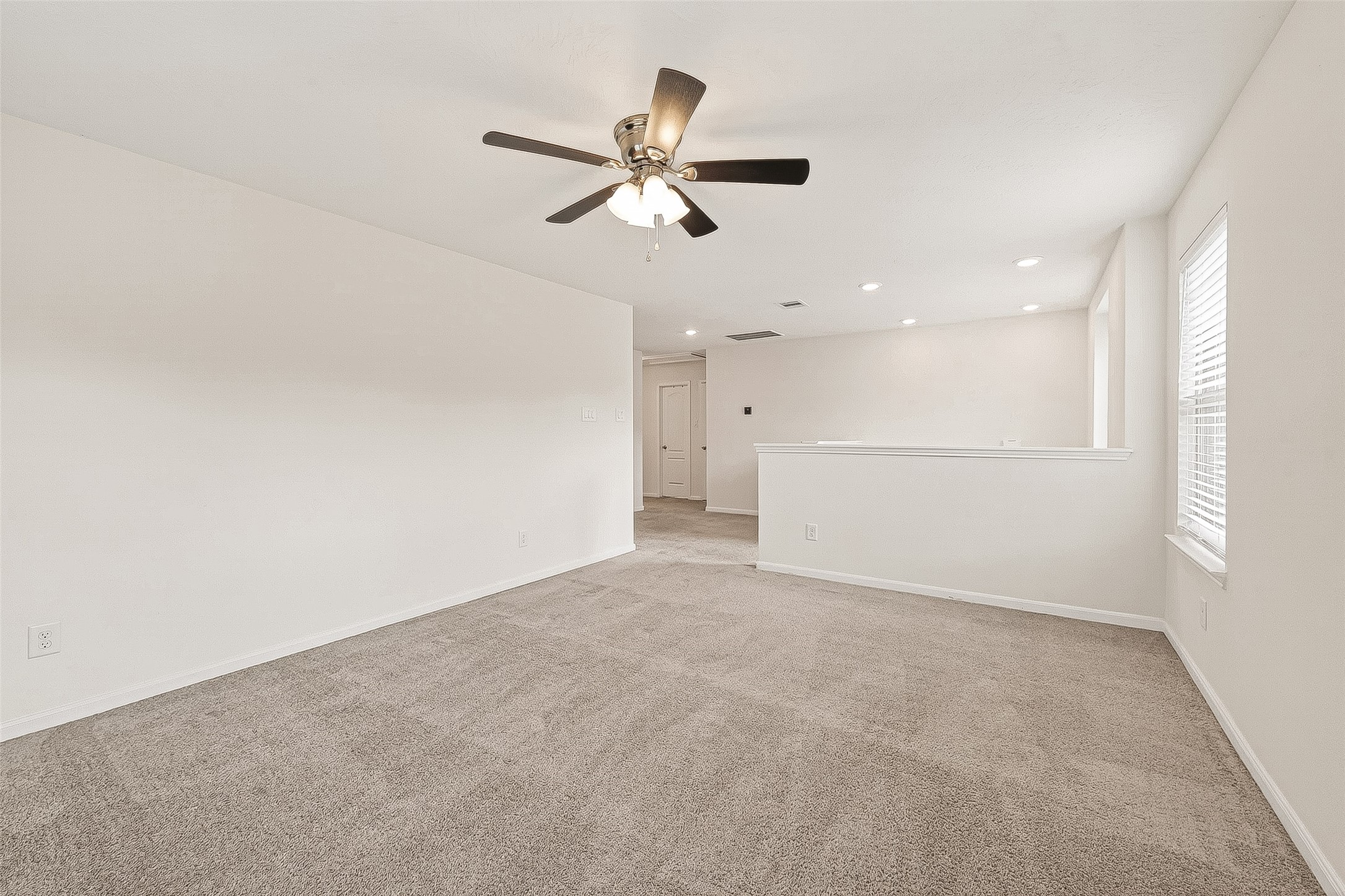 2107 Parnevik Place Conroe, TX 77304 - Photo 18 of 44 Right at the top of the stairs you will find the game room, or if you prefer, a second family room.