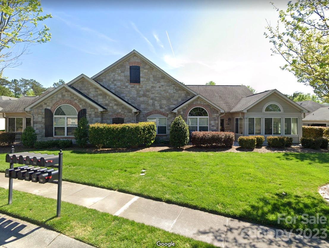 721 Ledgestone Court Tega Cay, SC 29708 - Photo 1 of 35 a front view of house with yard and green space