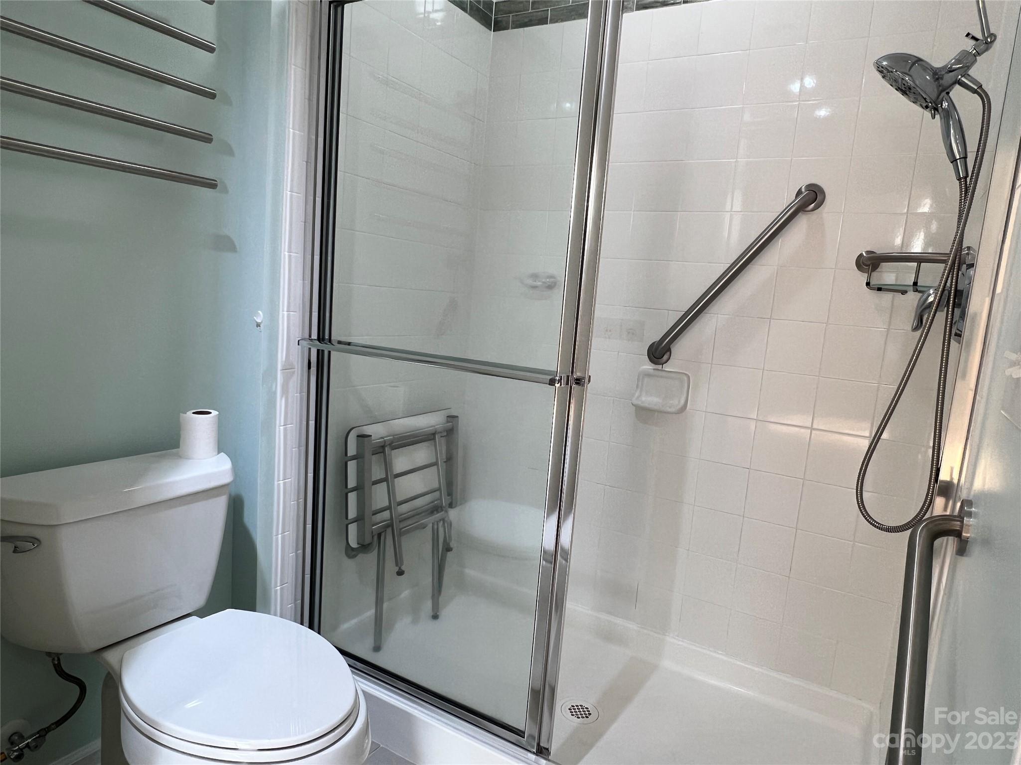 721 Ledgestone Court Tega Cay, SC 29708 - Photo 14 of 35 a white toilet sitting next to a bath tub