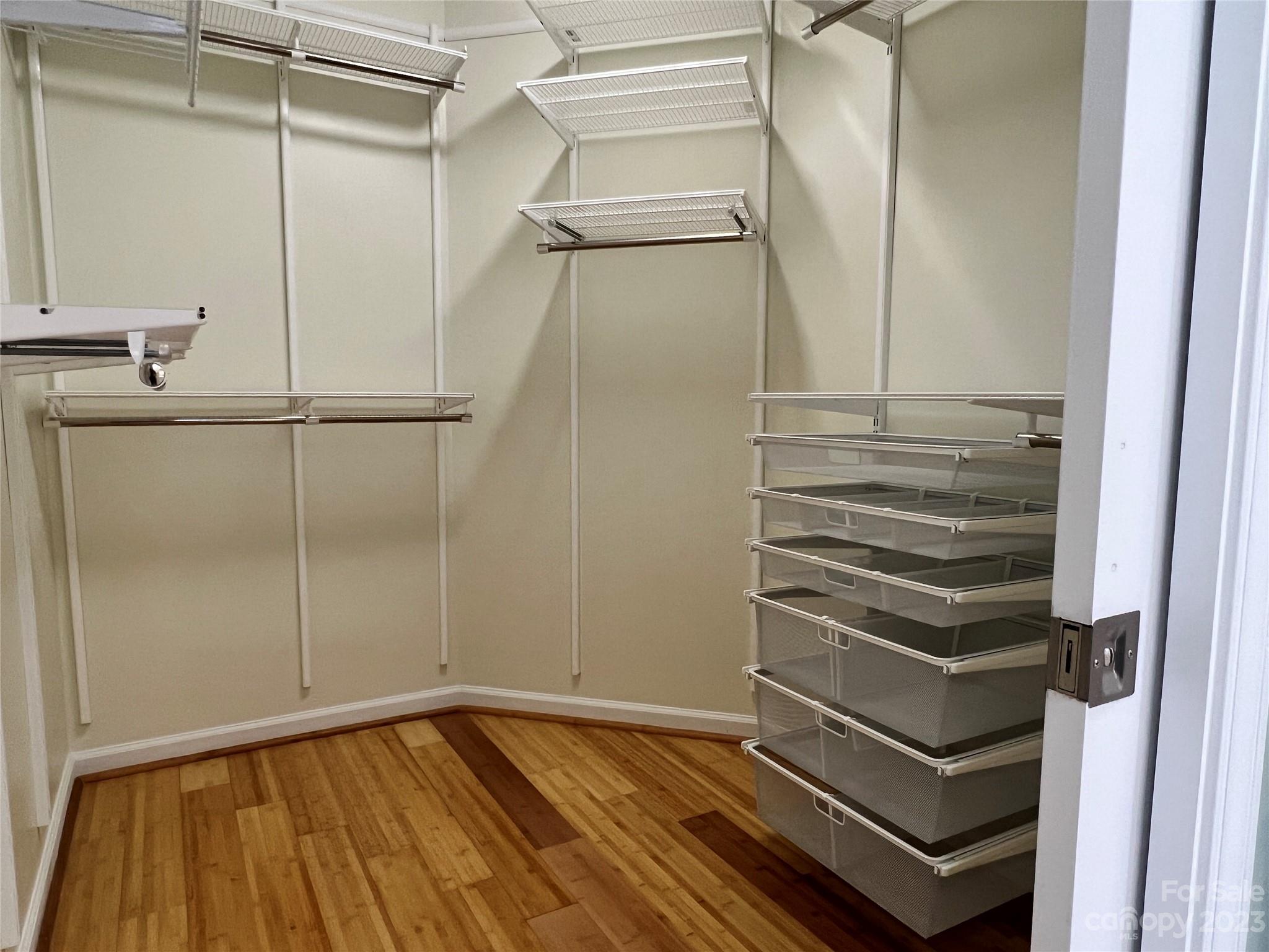 721 Ledgestone Court Tega Cay, SC 29708 - Photo 15 of 35 a view of walk in closet with empty racks