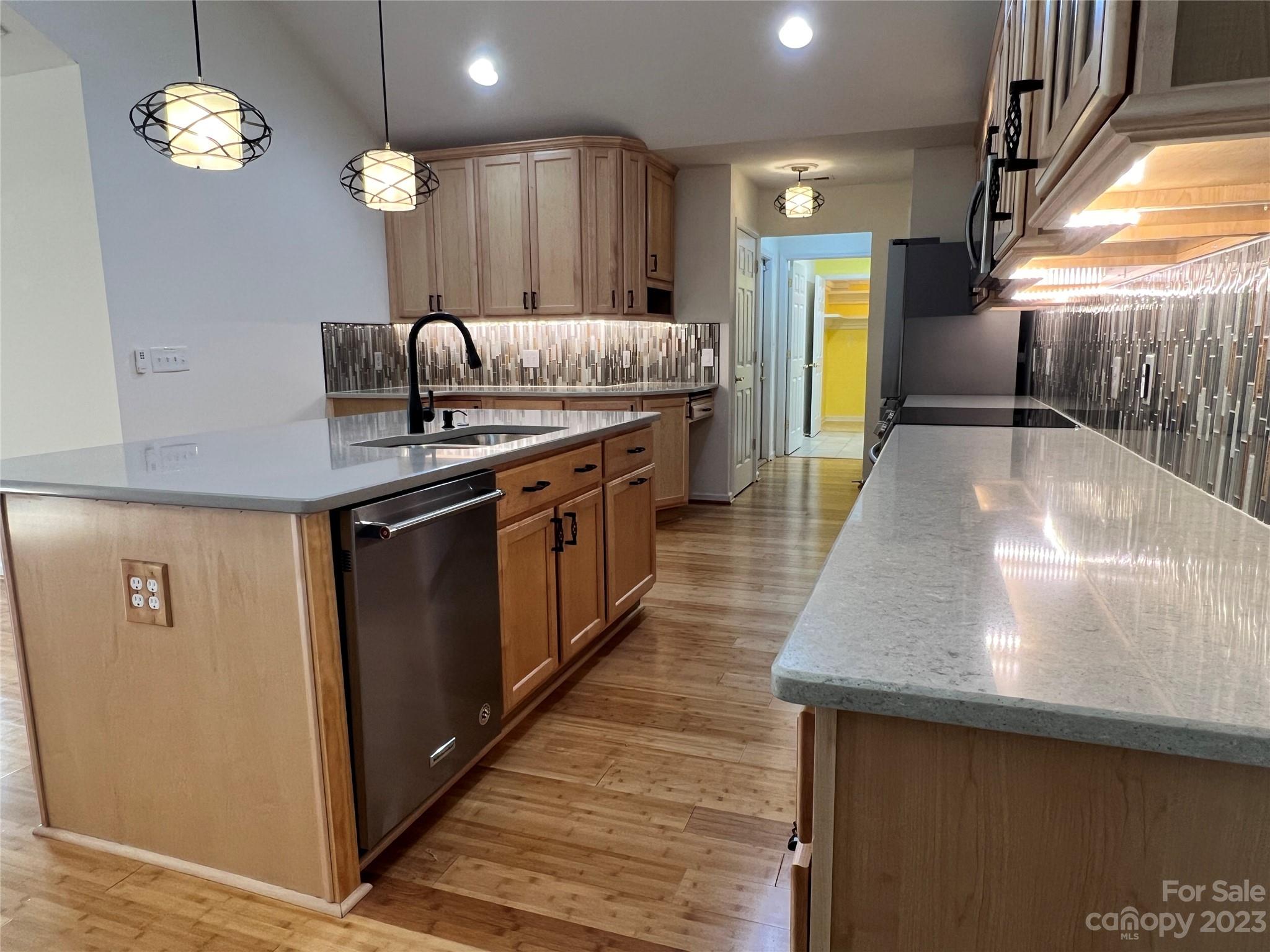 721 Ledgestone Court Tega Cay, SC 29708 - Photo 19 of 35 a kitchen with stainless steel appliances granite countertop a sink a oven and a refrigerator