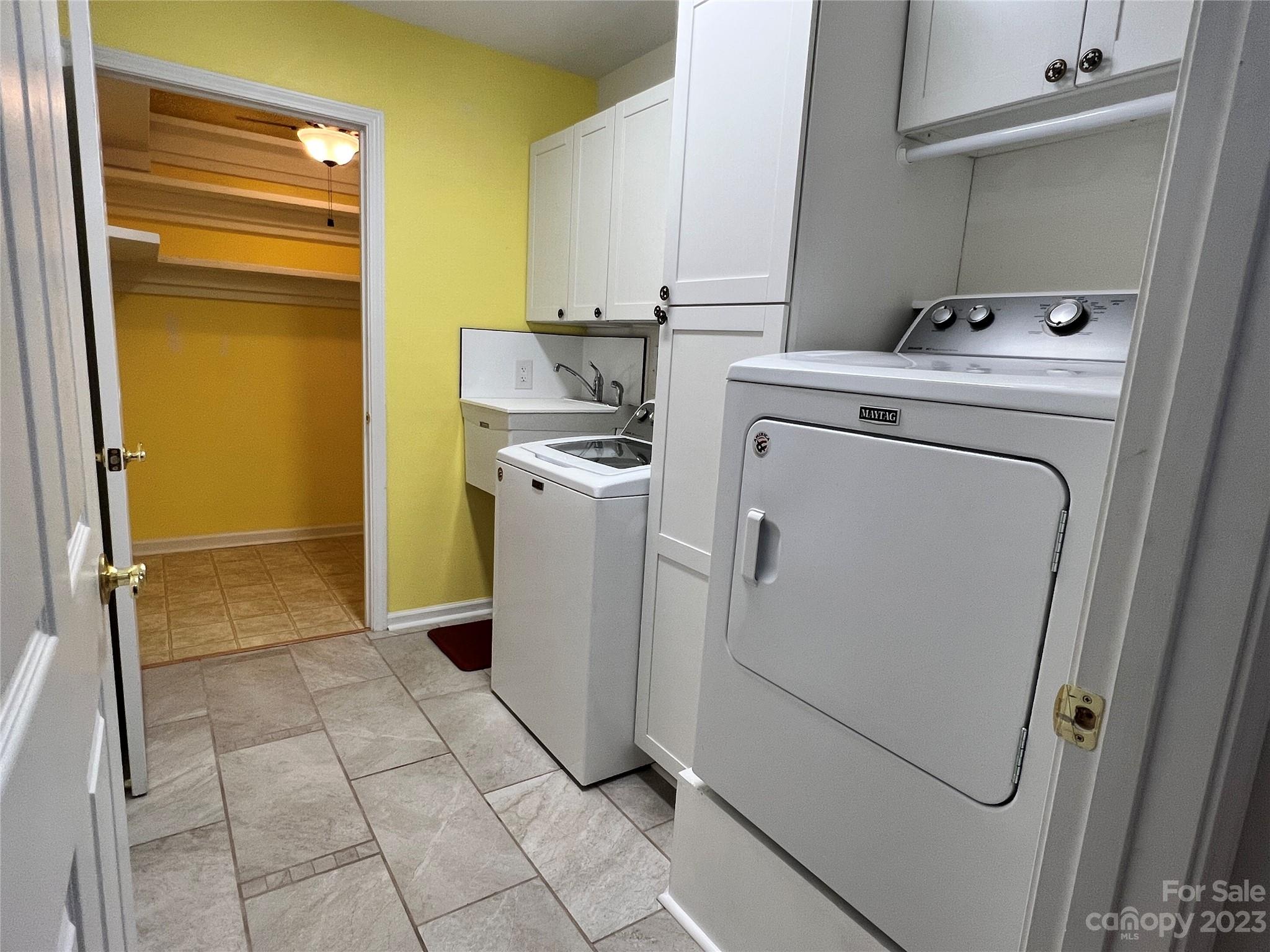 721 Ledgestone Court Tega Cay, SC 29708 - Photo 26 of 35 a utility room with dryer and washer
