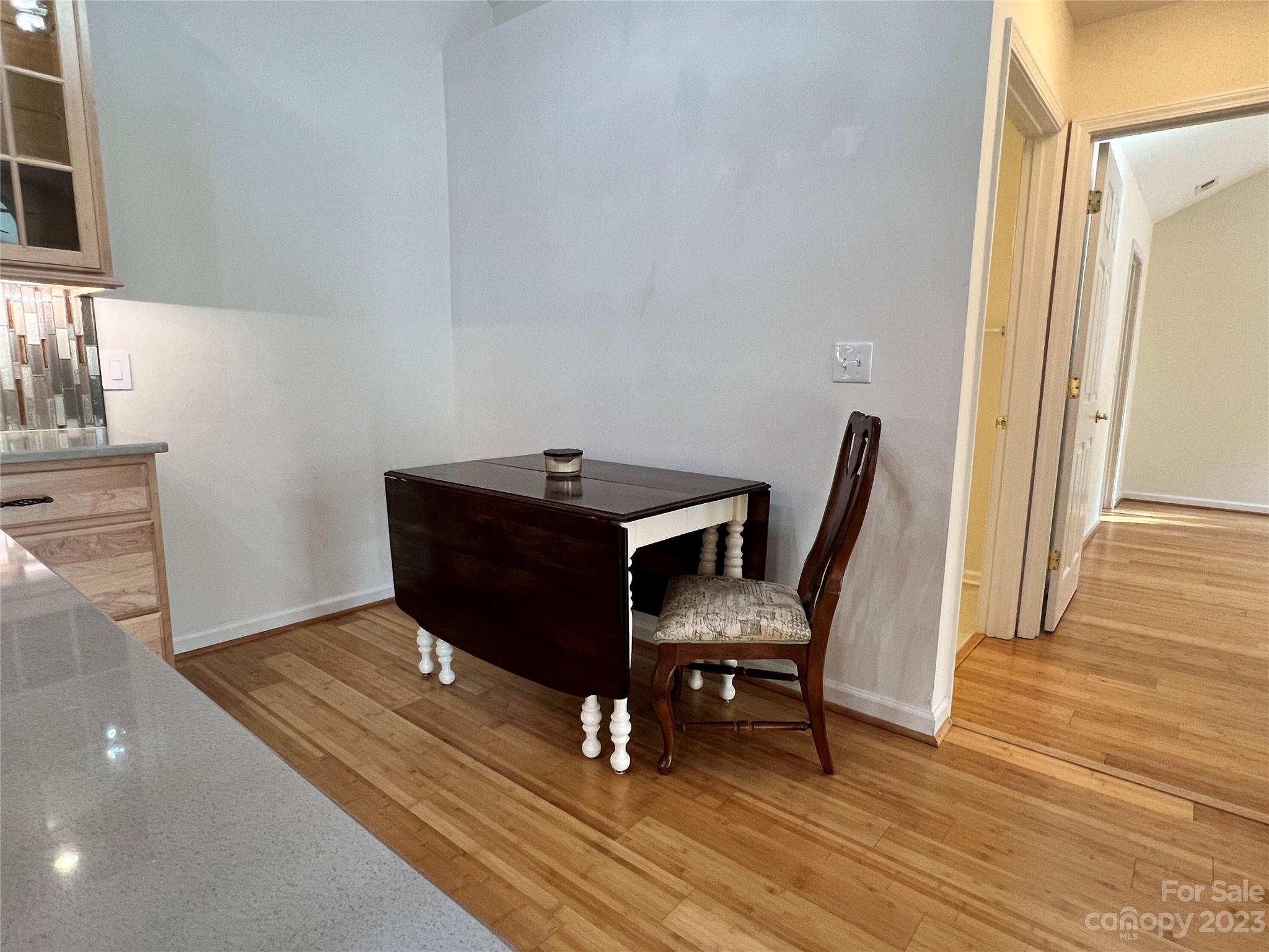721 Ledgestone Court Tega Cay, SC 29708 - Photo 29 of 35 a living room with furniture and a wooden floor