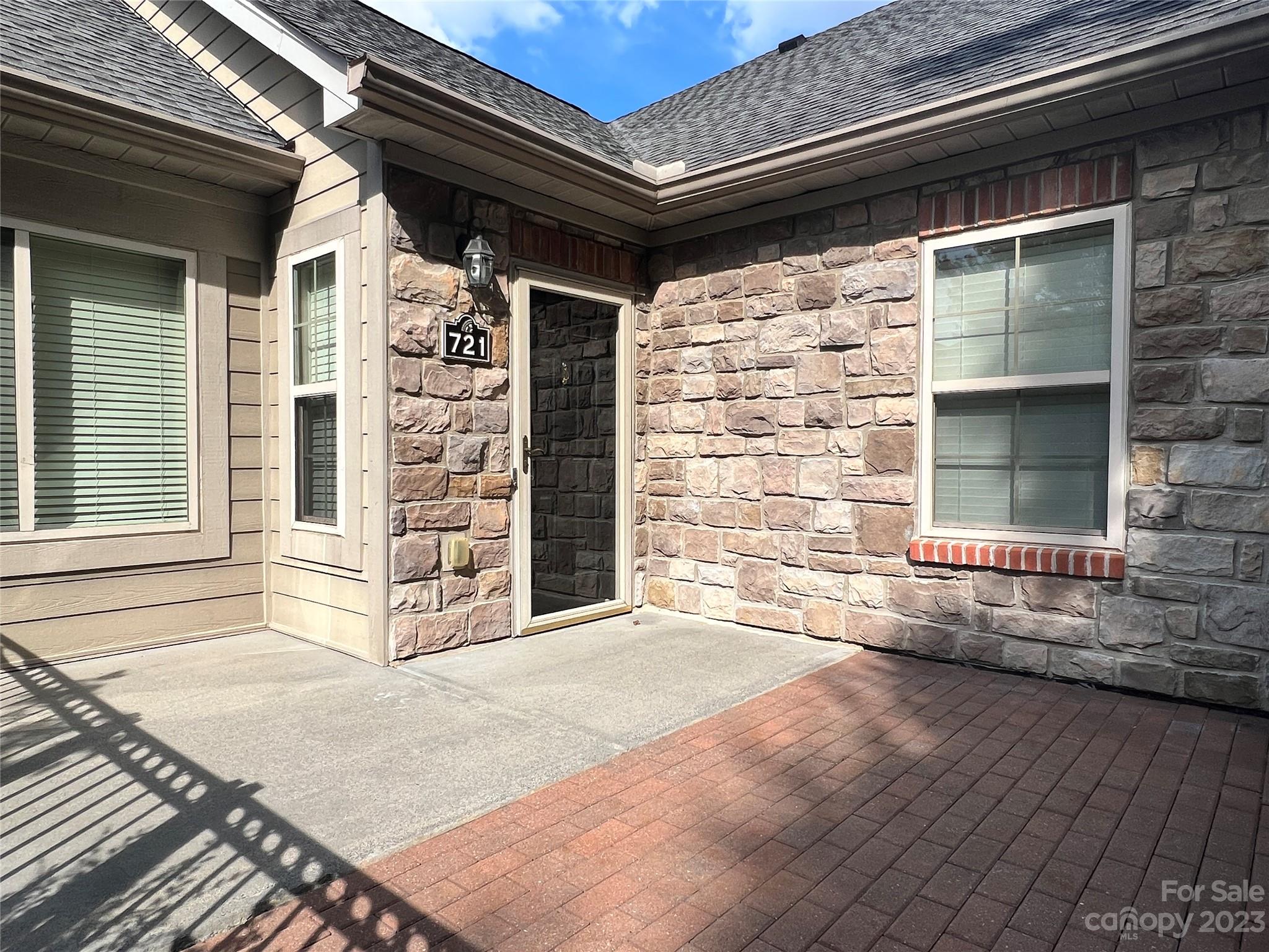 721 Ledgestone Court Tega Cay, SC 29708 - Photo 3 of 35 an empty room with wooden floor and windows