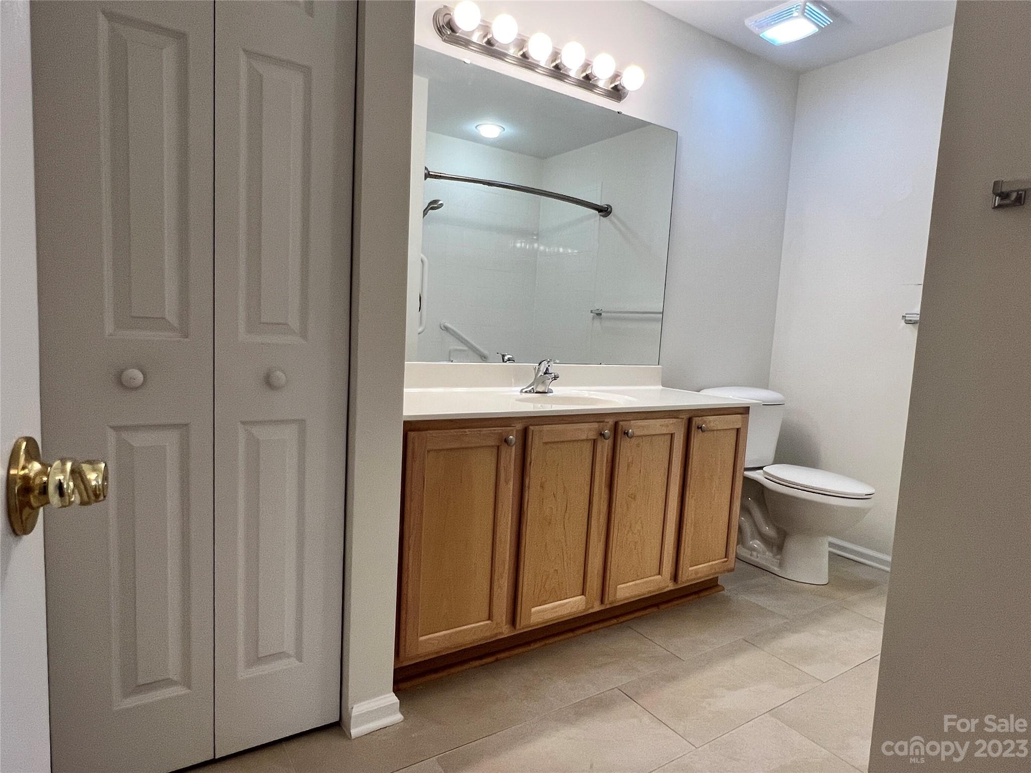 721 Ledgestone Court Tega Cay, SC 29708 - Photo 32 of 35 a bathroom with a sink a toilet and shower