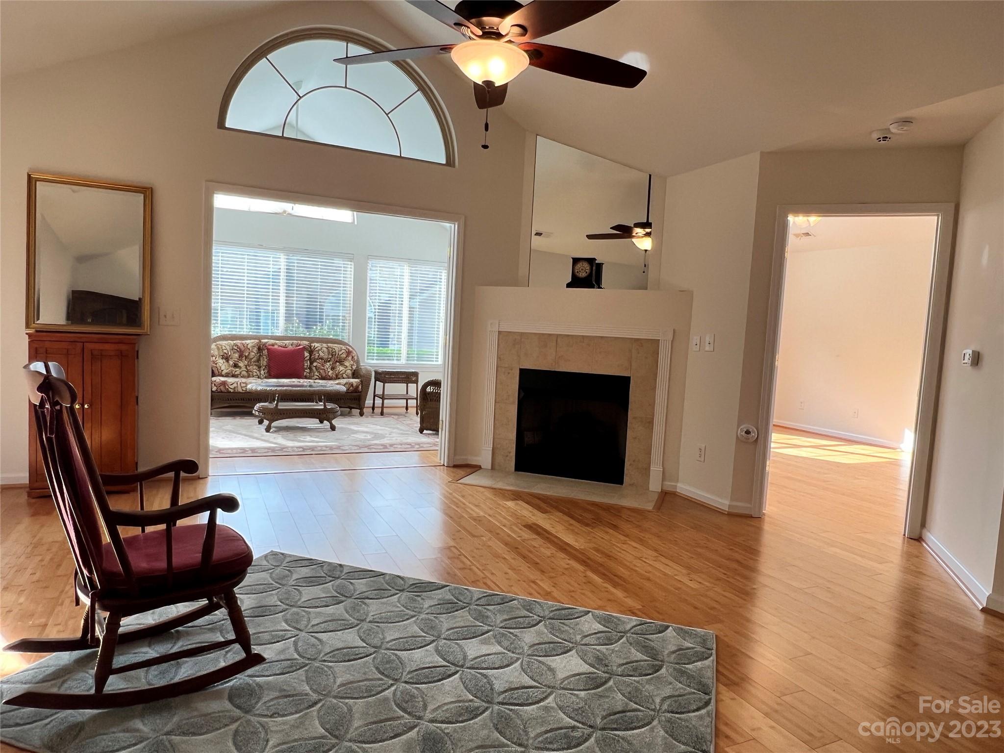721 Ledgestone Court Tega Cay, SC 29708 - Photo 10 of 35 a living room with furniture and a fireplace