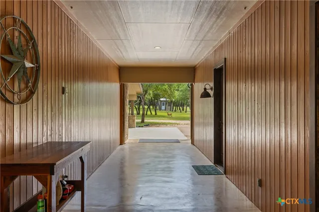 a view of gallery with wooden floor