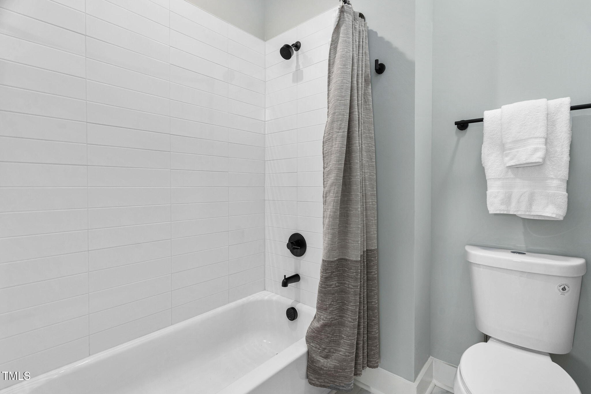 2325 Sheffield Road, Unit 102 Raleigh, NC 27610 - Photo 20 of 38 a bathroom with a toilet and a shower