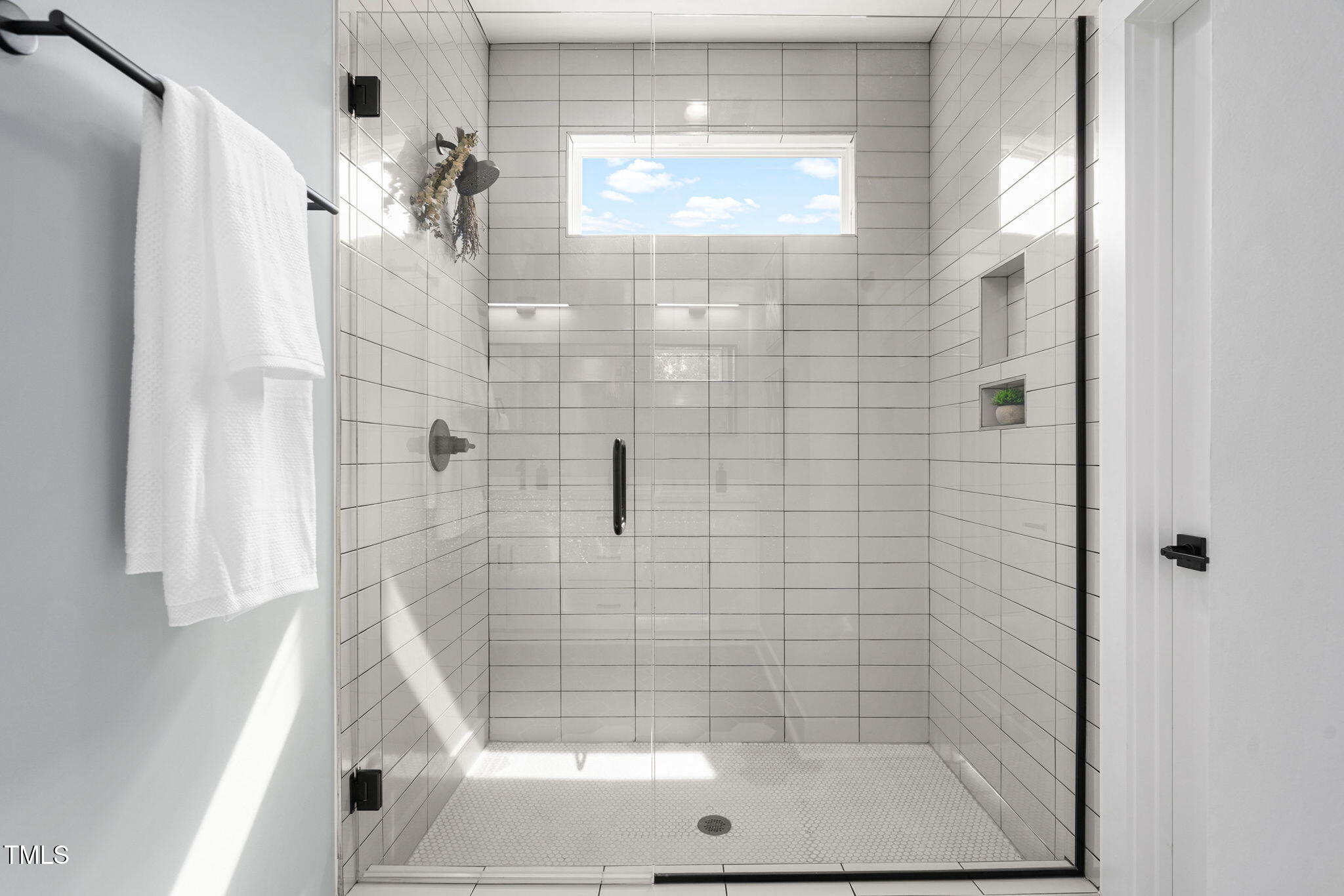 2325 Sheffield Road, Unit 102 Raleigh, NC 27610 - Photo 23 of 38 a bathroom with a shower