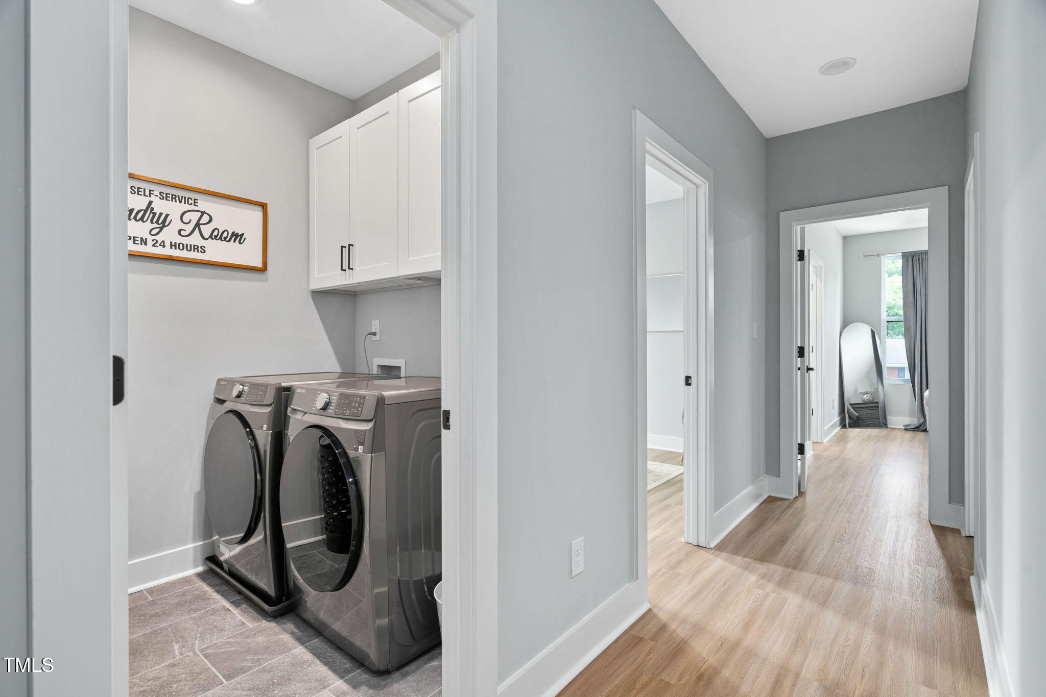2325 Sheffield Road, Unit 102 Raleigh, NC 27610 - Photo 28 of 38 a view of a storage and utility room with washer and dryer