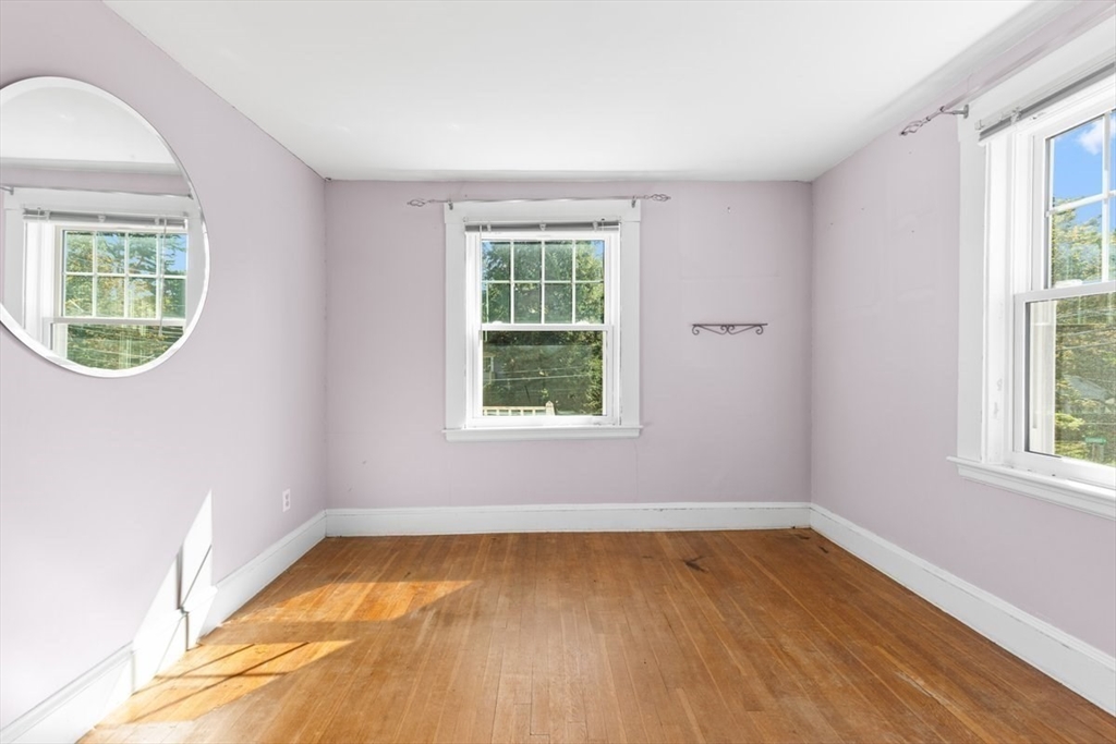 14 Cottage Street Sharon, MA 02067 - Photo 17 of 27 an empty room with wooden floor and windows