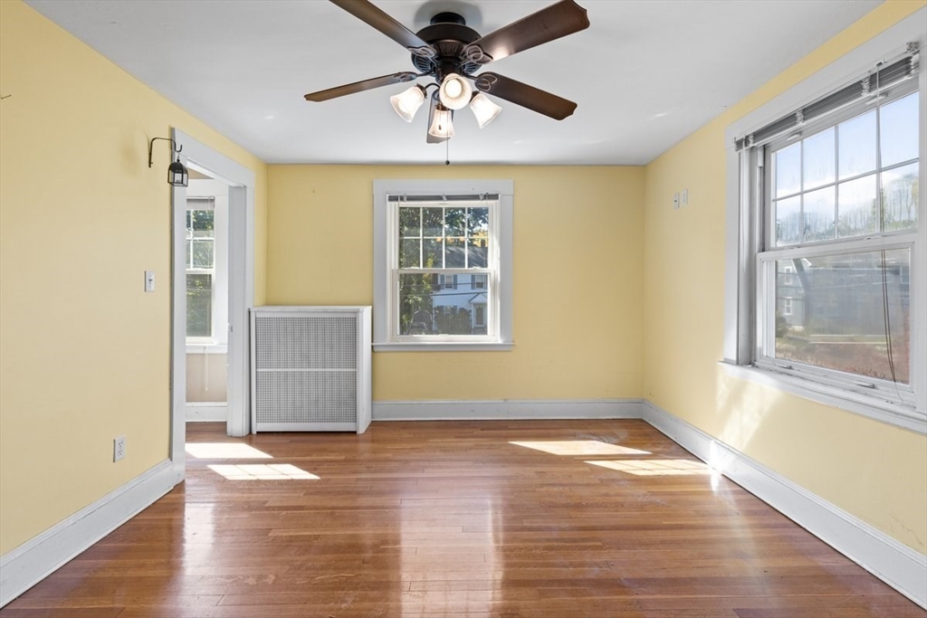 14 Cottage Street Sharon, MA 02067 - Photo 18 of 27 a view of an empty room with window and wooden floor