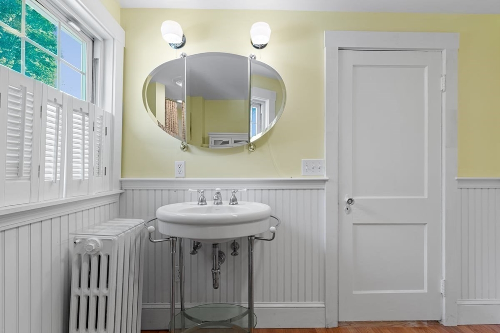 14 Cottage Street Sharon, MA 02067 - Photo 19 of 27 a bathroom with a sink and a mirror