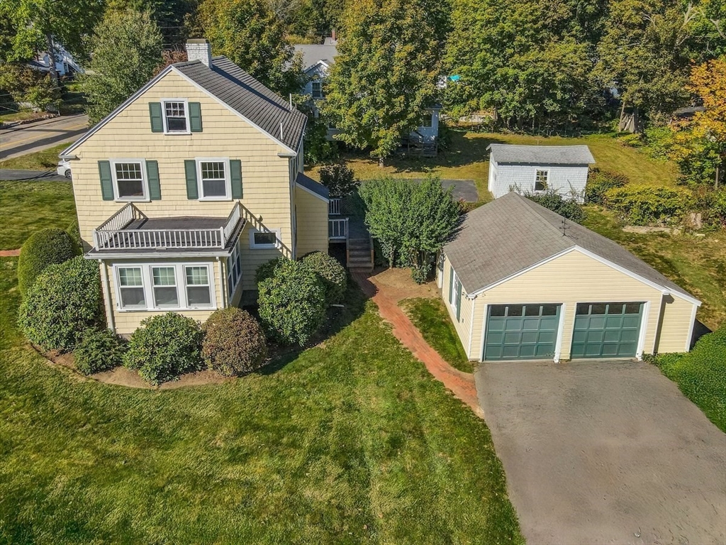 14 Cottage Street Sharon, MA 02067 - Photo 3 of 27 a front view of a house with a yard