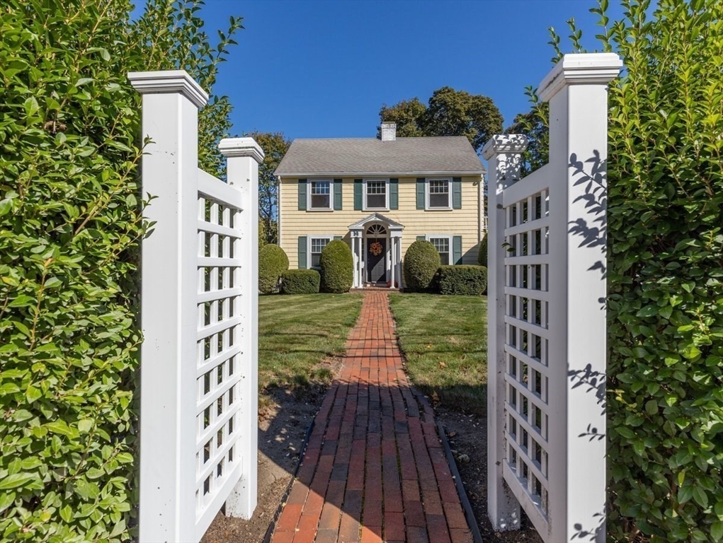 14 Cottage Street Sharon, MA 02067 - Photo 5 of 27 a front view of a house with a yard