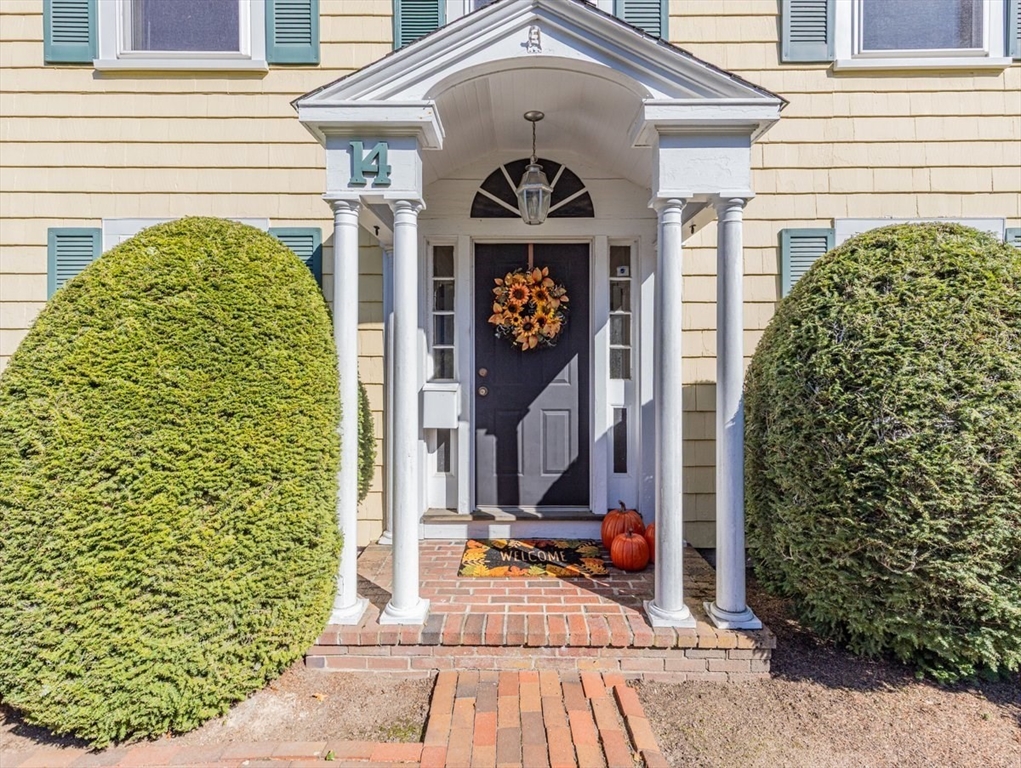 14 Cottage Street Sharon, MA 02067 - Photo 6 of 27 a view of a brick house with potted plants