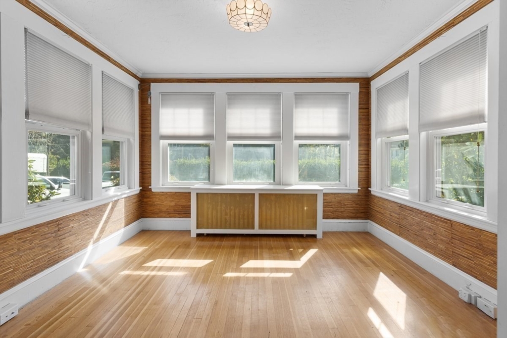 14 Cottage Street Sharon, MA 02067 - Photo 9 of 27 a view of an empty room with wooden floor and a window