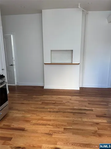 a view of room and wooden floor