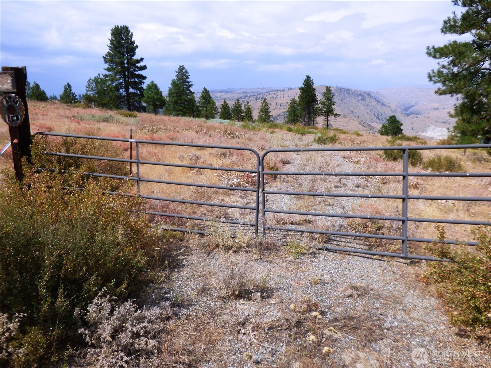 0 Mountain Point Road Brewster, WA 98812 - Photo 4 of 11 a view of a dry yard with wooden fence