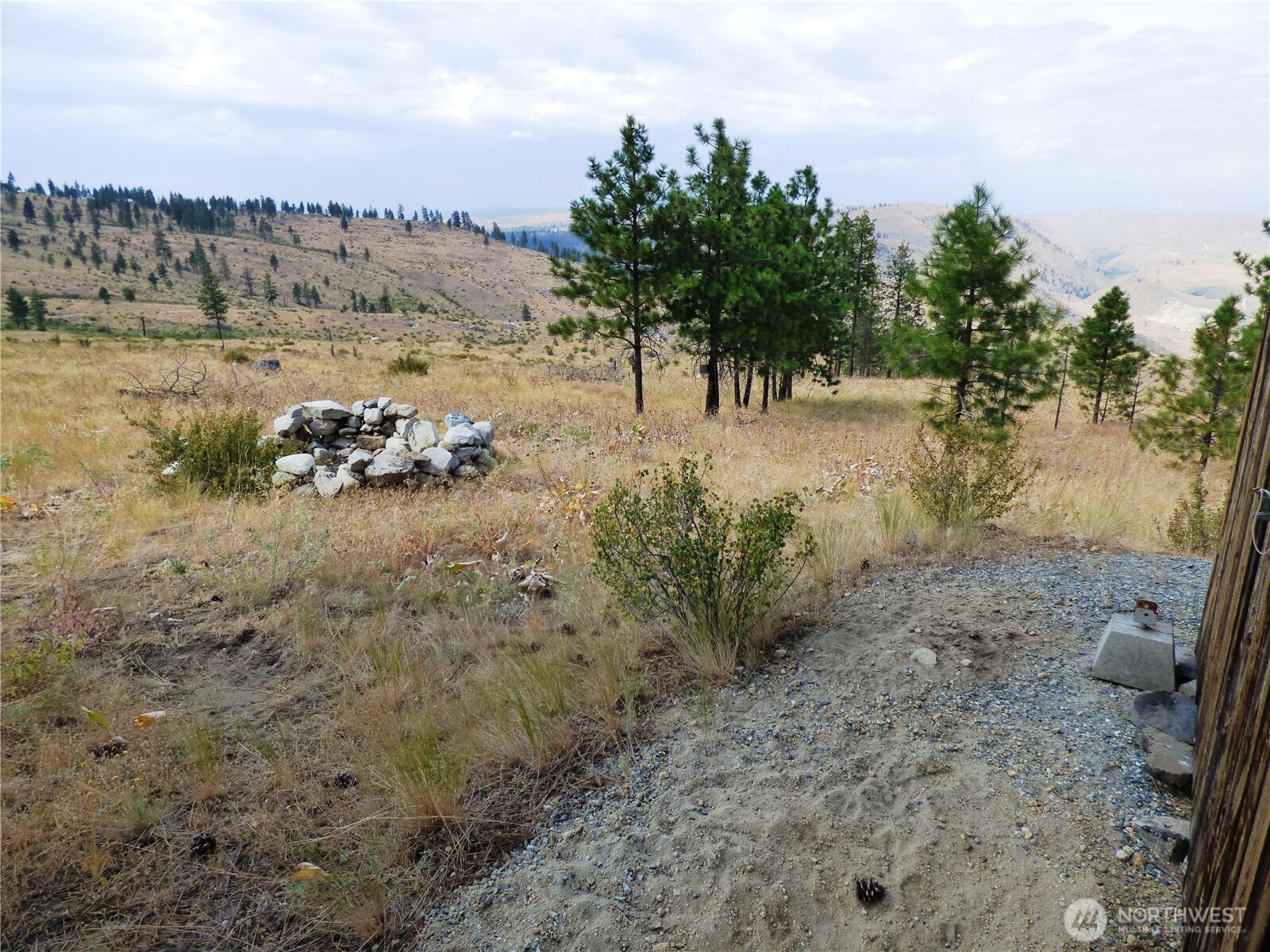 0 Mountain Point Road Brewster, WA 98812 - Photo 7 of 11 a view of a yard with wooden fence