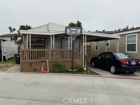 124 East Balboa Tustin, CA 92780 - Photo 3 of 9 a view of a car park in front of house