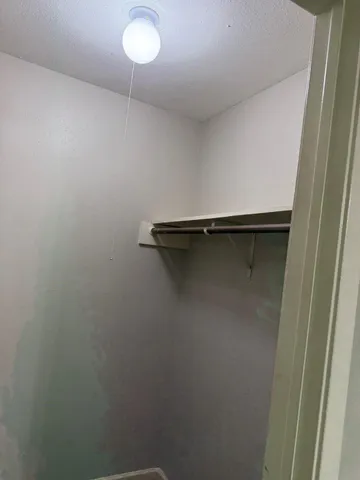 a close view of a closet in the bathroom