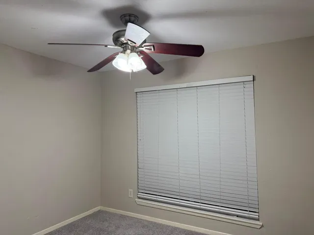 a view of a small space with a fan