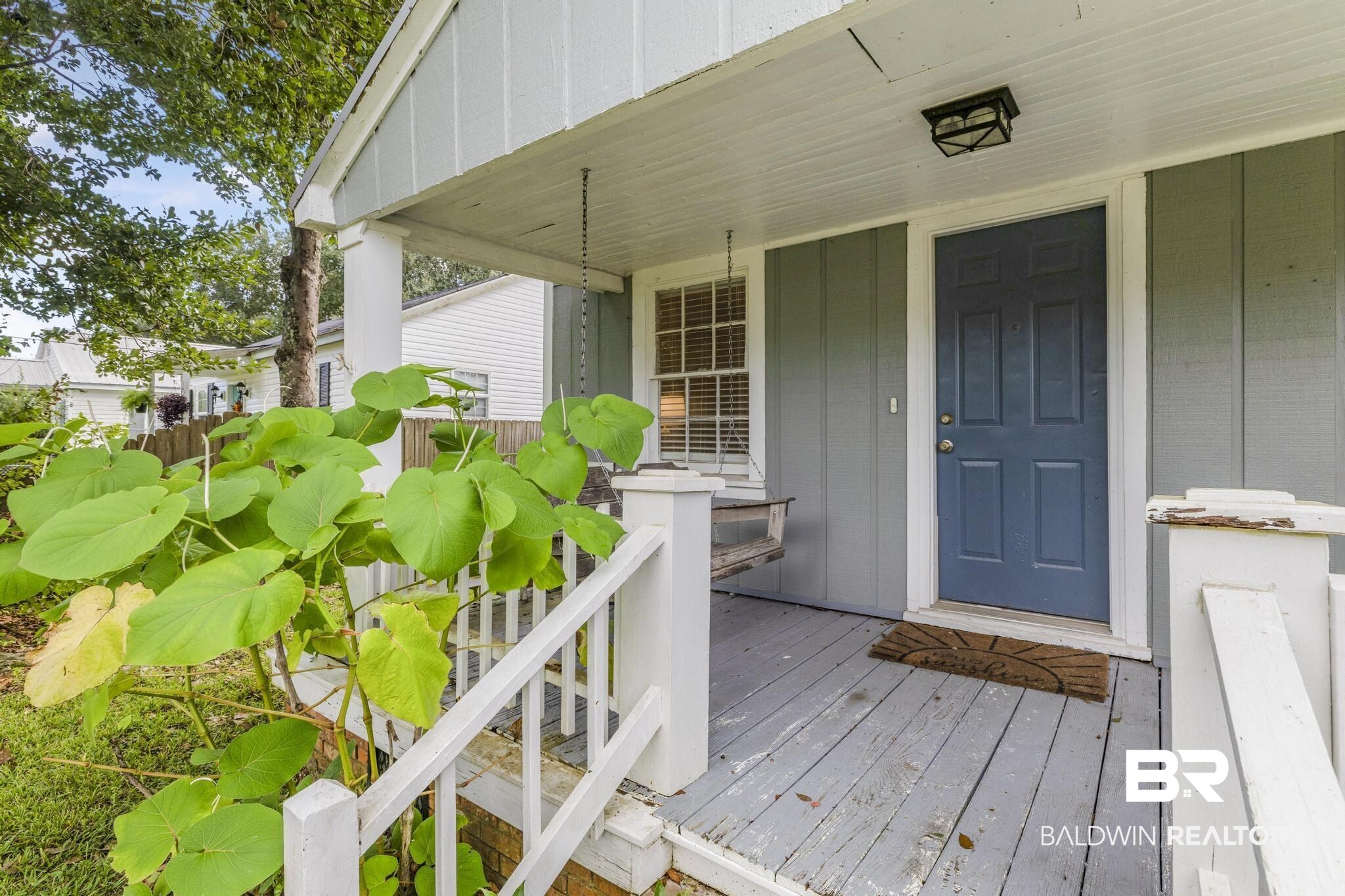 405 North Pine Street Foley, AL 36535 - Photo 11 of 33 Entrance to property featuring board and batten siding and covered porch
