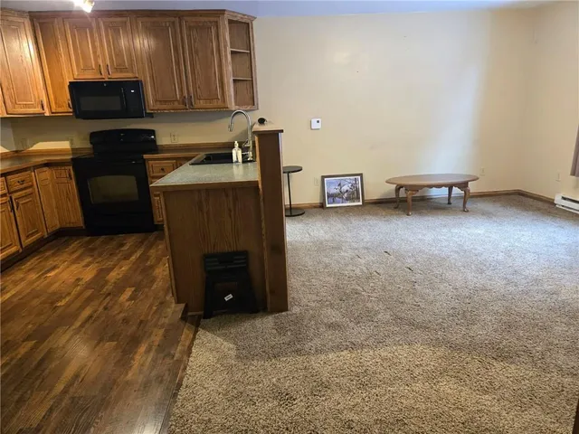 a kitchen with a sink and a stove top oven