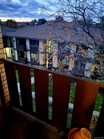 a view of a chairs and table in a patio
