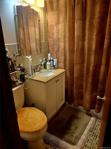 a bedroom with bed and a couch