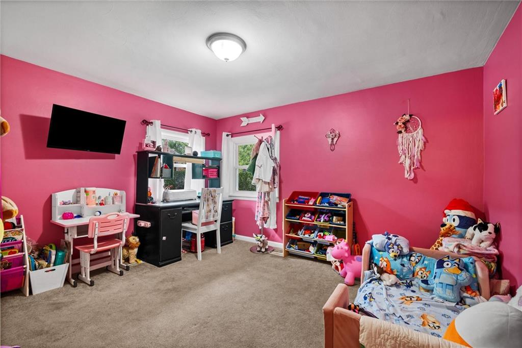 56 Concord Road Hermitage, PA 16148 - Photo 11 of 23 a bedroom with furniture and a flat screen tv