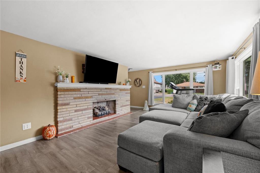 56 Concord Road Hermitage, PA 16148 - Photo 2 of 23 a living room with furniture a fireplace and a flat screen tv