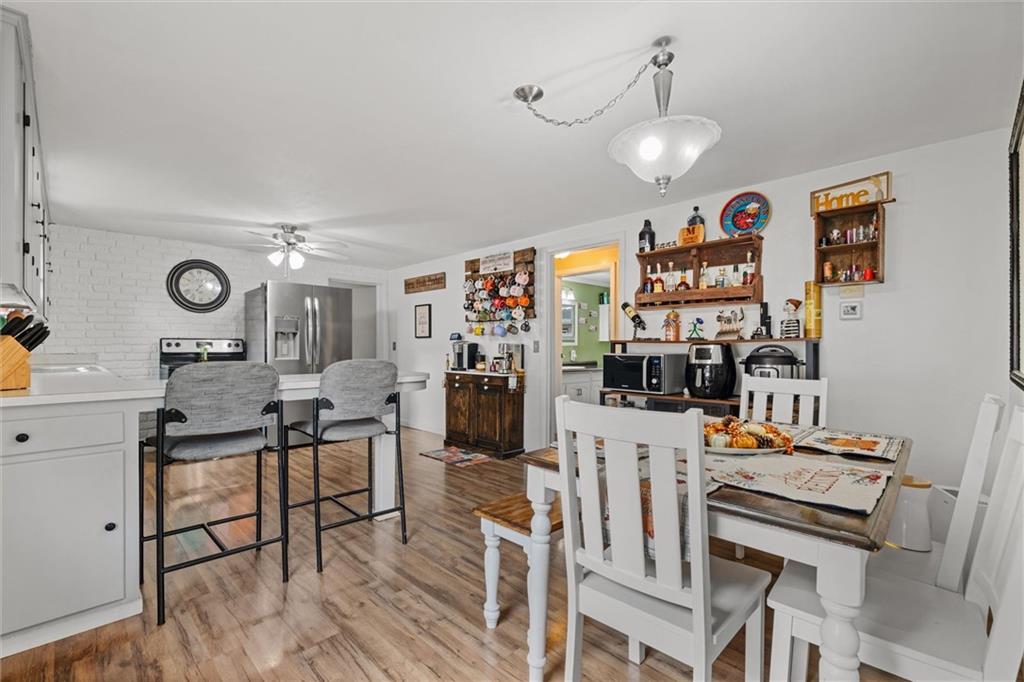56 Concord Road Hermitage, PA 16148 - Photo 3 of 23 a view of a dining room with furniture and wooden floor