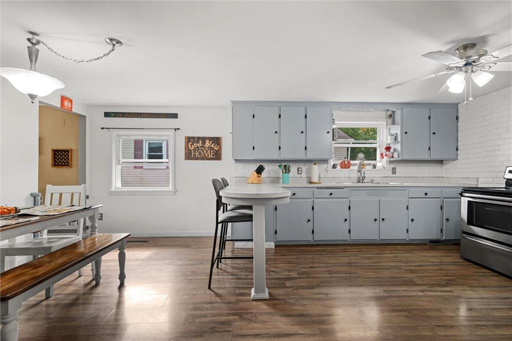 56 Concord Road Hermitage, PA 16148 - Photo 4 of 23 a kitchen with a sink cabinets and wooden floor