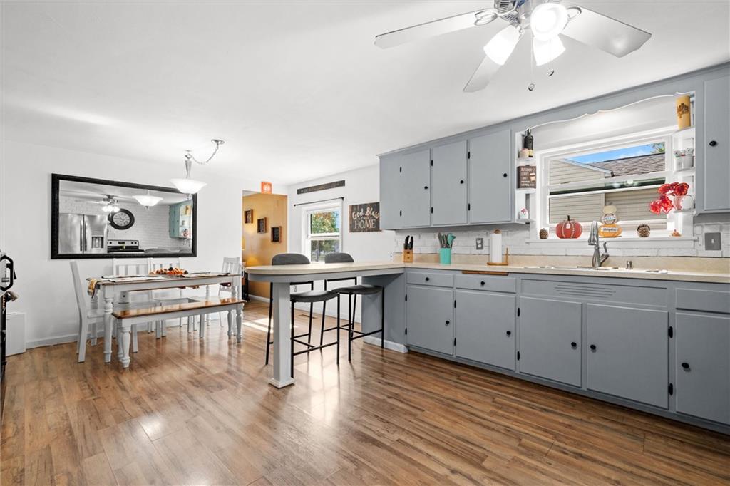 56 Concord Road Hermitage, PA 16148 - Photo 9 of 23 a living room with furniture and wooden floor