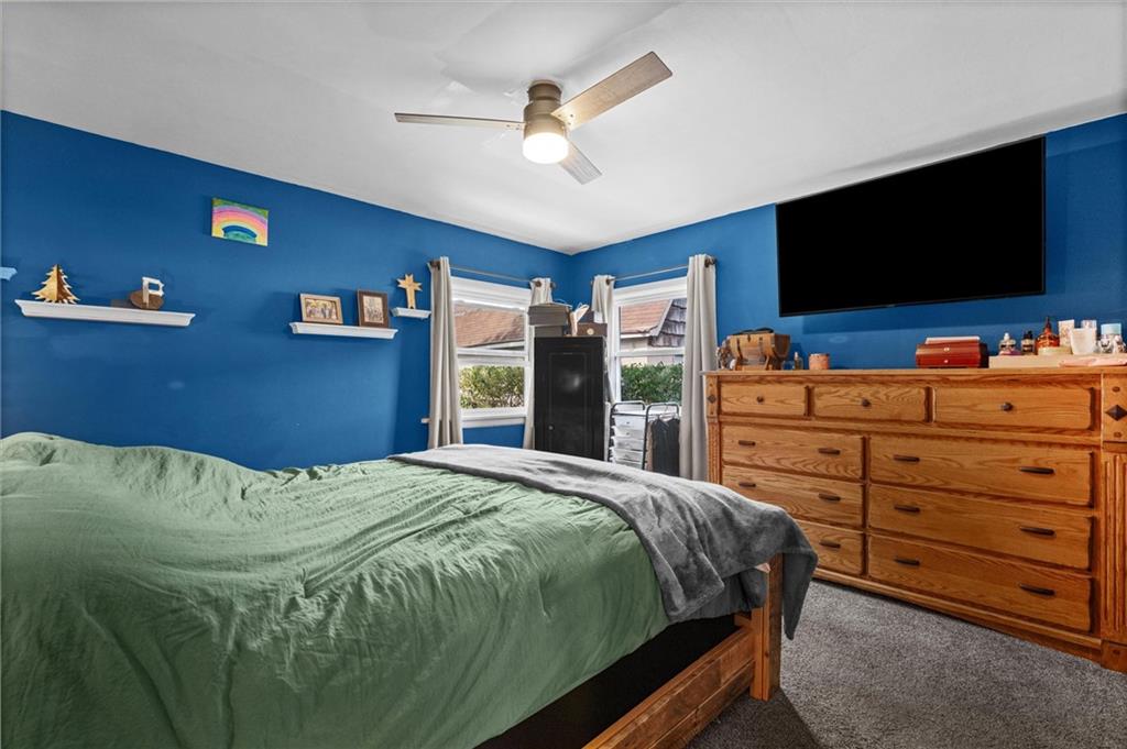 56 Concord Road Hermitage, PA 16148 - Photo 10 of 23 a bedroom with a bed and a flat screen tv