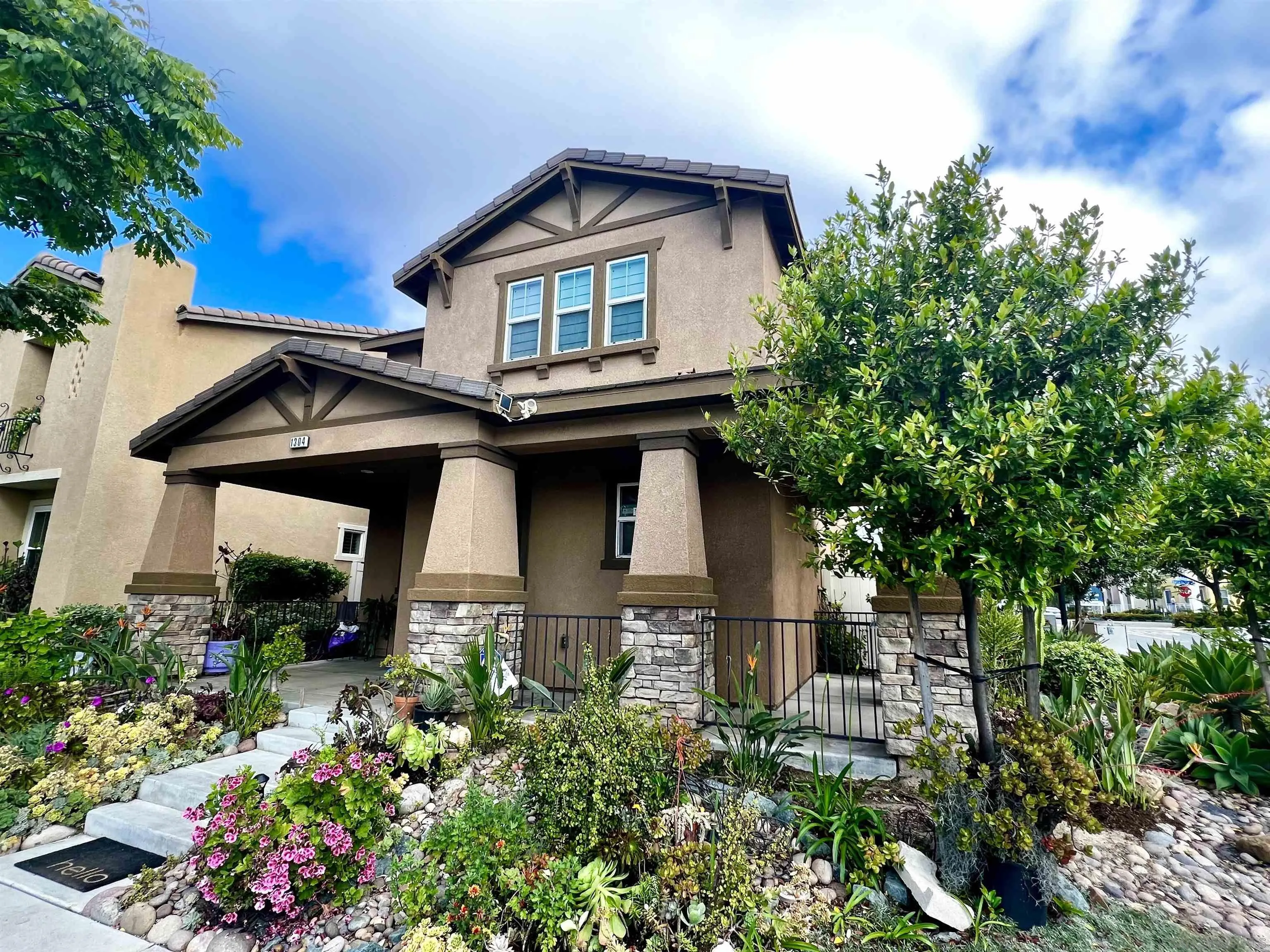 front view of a house with a small yard