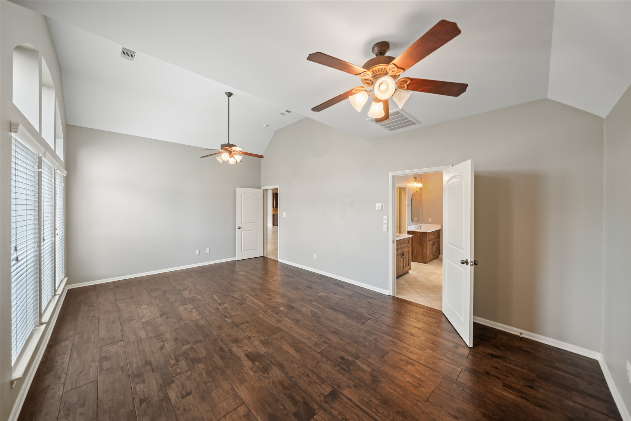 2818 Red Maple Drive Katy, TX 77494 - Photo 35 of 50 wooden floor in an empty room with a window