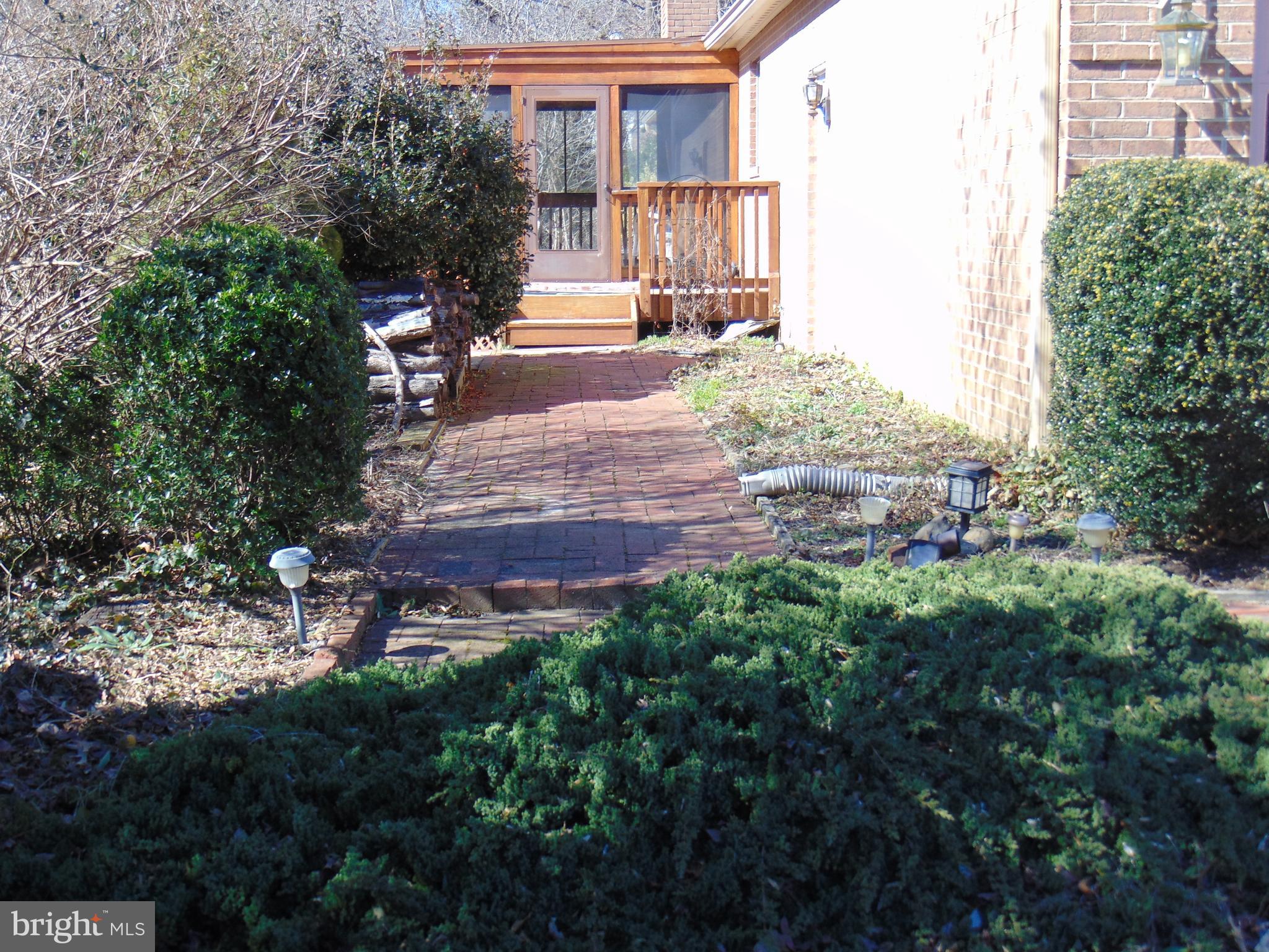 6514 Wilson Road Friendship, MD 20758 - Photo 35 of 38 Landscaped walkway from Garage to Deck/Sunroom