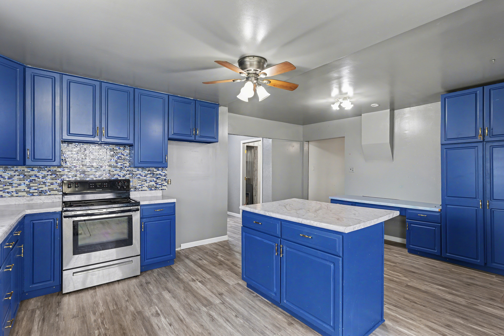 724 East 2600 North Road Penfield, IL 61862 - Photo 15 of 43 a kitchen with wooden cabinets and stainless steel appliances