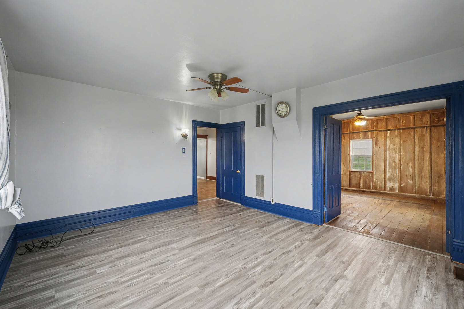 724 East 2600 North Road Penfield, IL 61862 - Photo 24 of 43 a view of an empty room with window and wooden floor