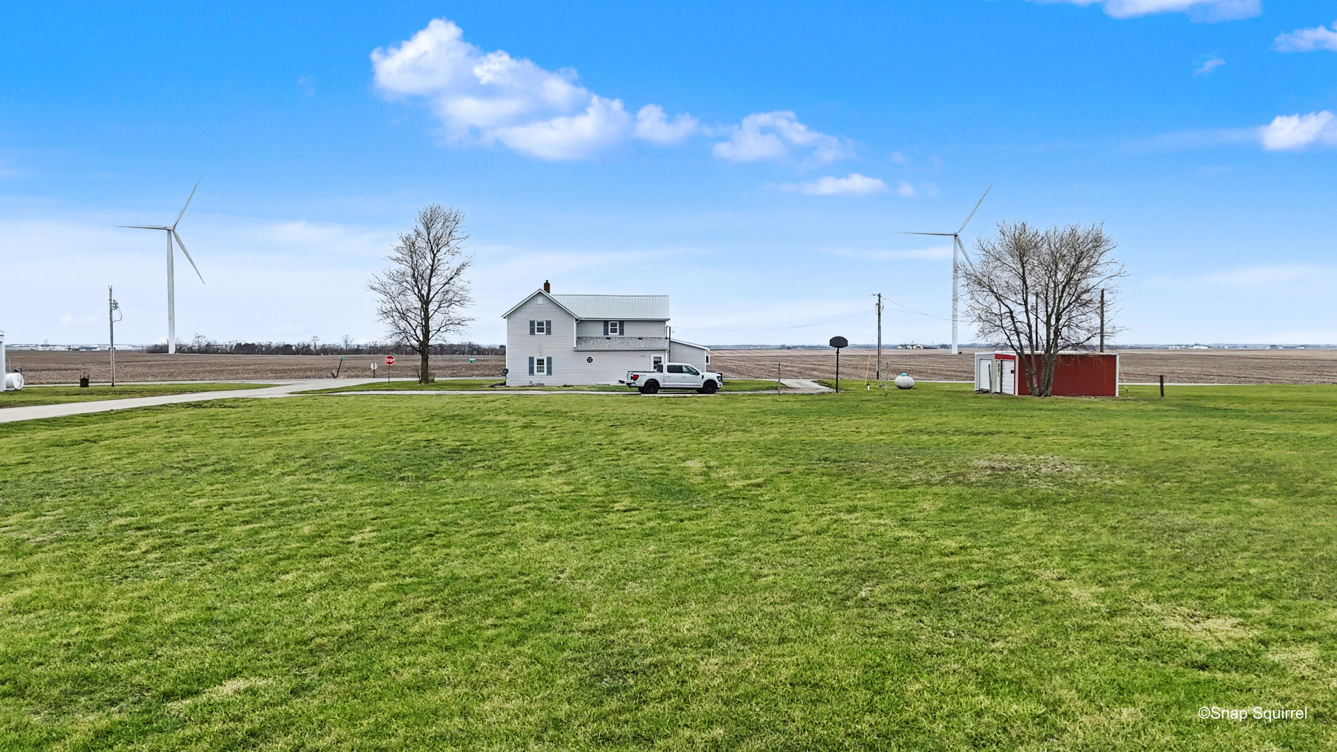 724 East 2600 North Road Penfield, IL 61862 - Photo 37 of 43 a view of a big yard with table and chairs