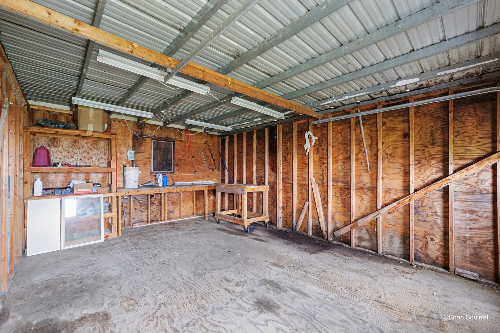 724 East 2600 North Road Penfield, IL 61862 - Photo 41 of 43 a view of an empty room with wooden walls