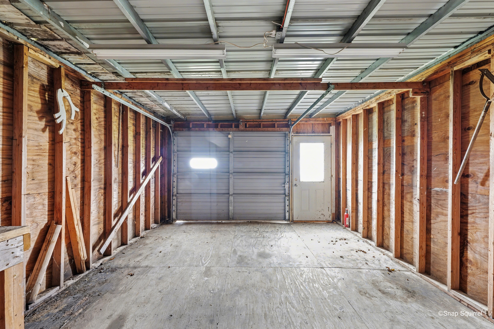 724 East 2600 North Road Penfield, IL 61862 - Photo 42 of 43 a view of empty room with wooden walls