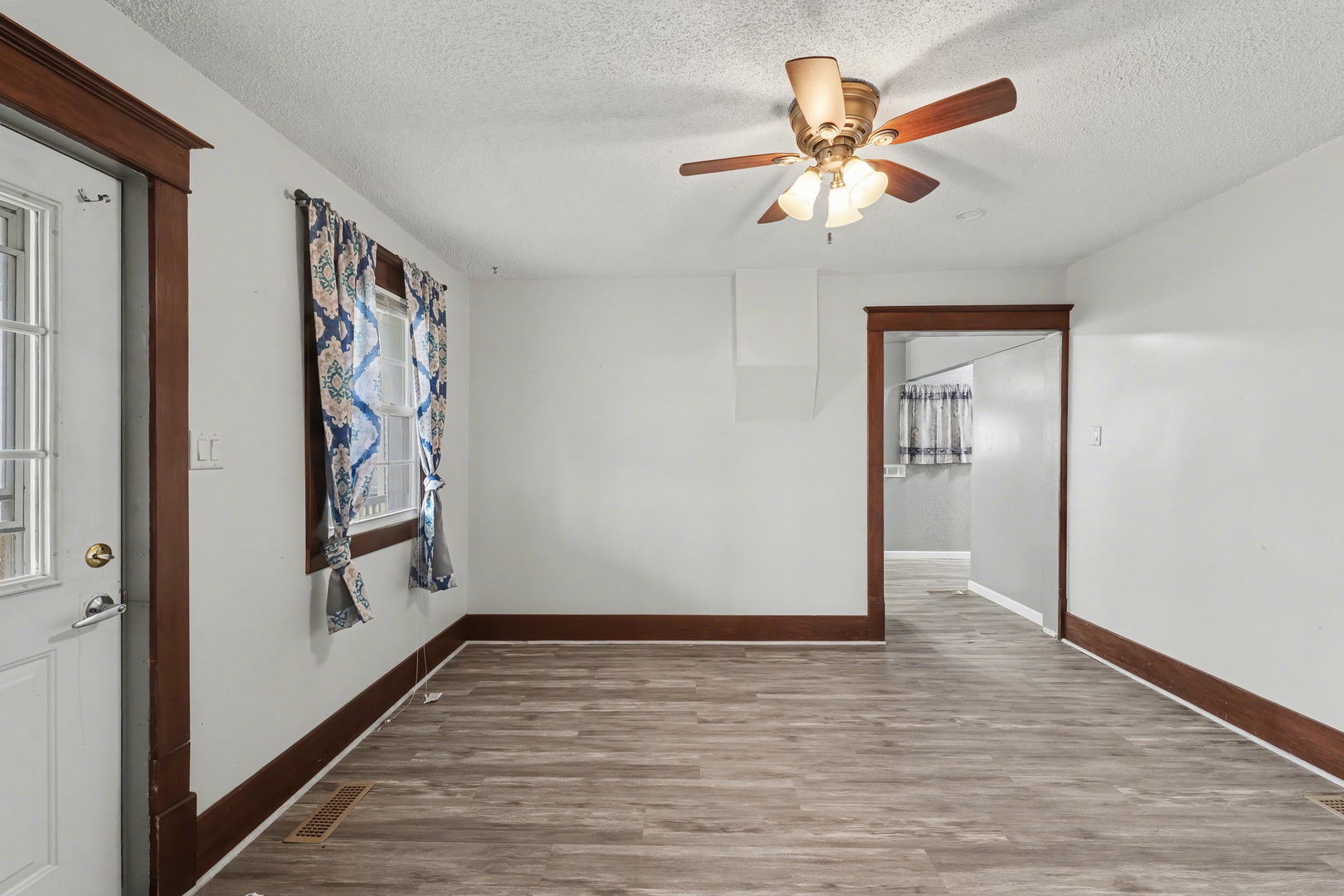 724 East 2600 North Road Penfield, IL 61862 - Photo 7 of 43 wooden floor in an empty room with a window